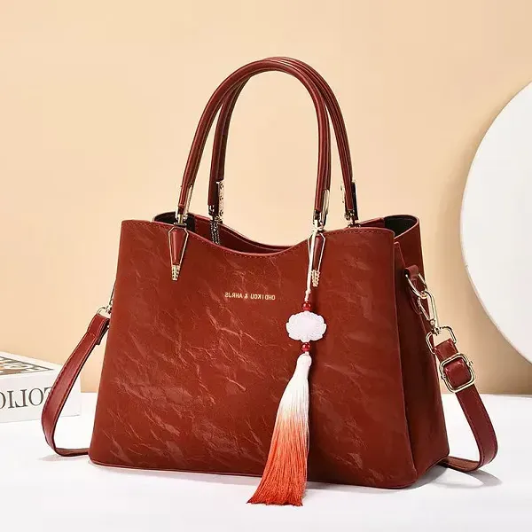 Thumbnail of Elegant Textured Handbag with Tassel Charm