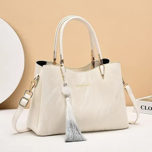 Thumbnail of Elegant Textured Handbag with Tassel Charm