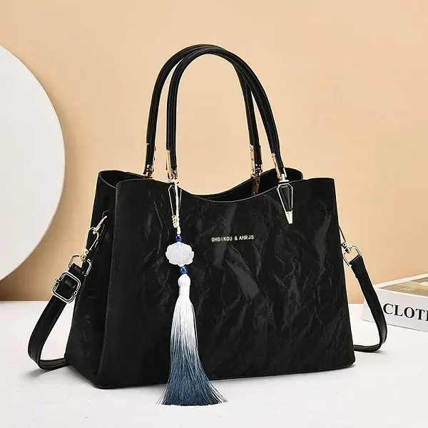 Thumbnail of Elegant Textured Handbag with Tassel Charm