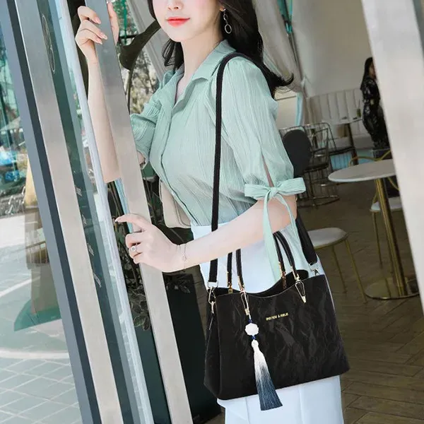 Thumbnail of Elegant Textured Handbag with Tassel Charm