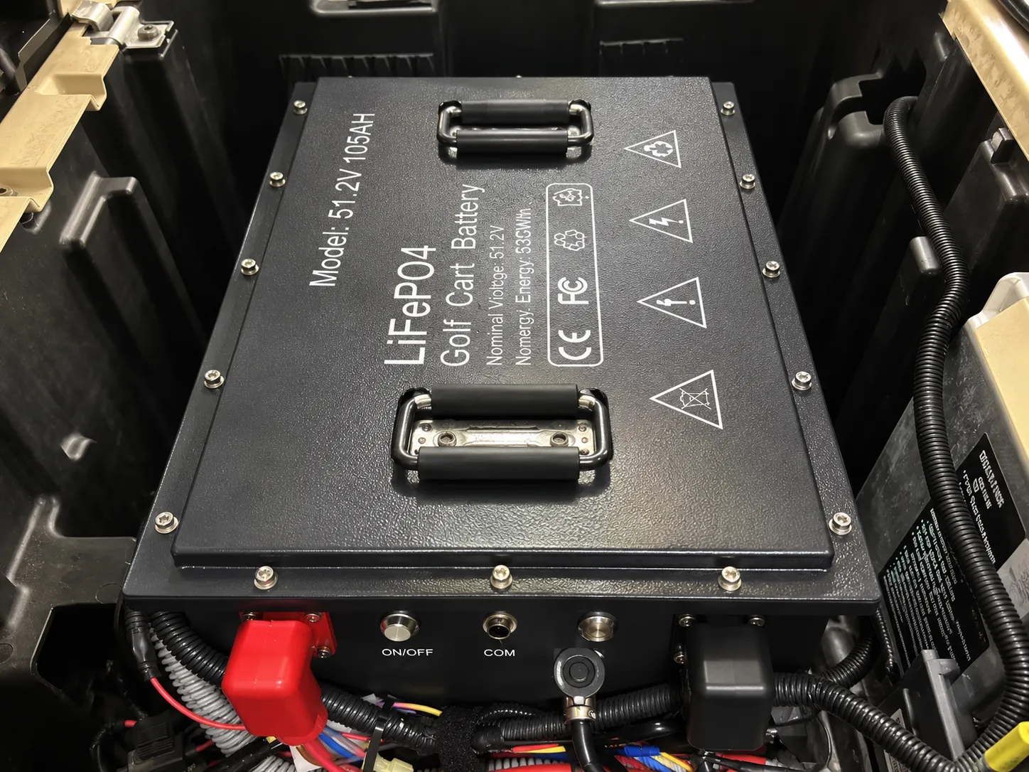 Completed 48V golf cart LiFePO4 battery retrofit installation in a limited battery compartment