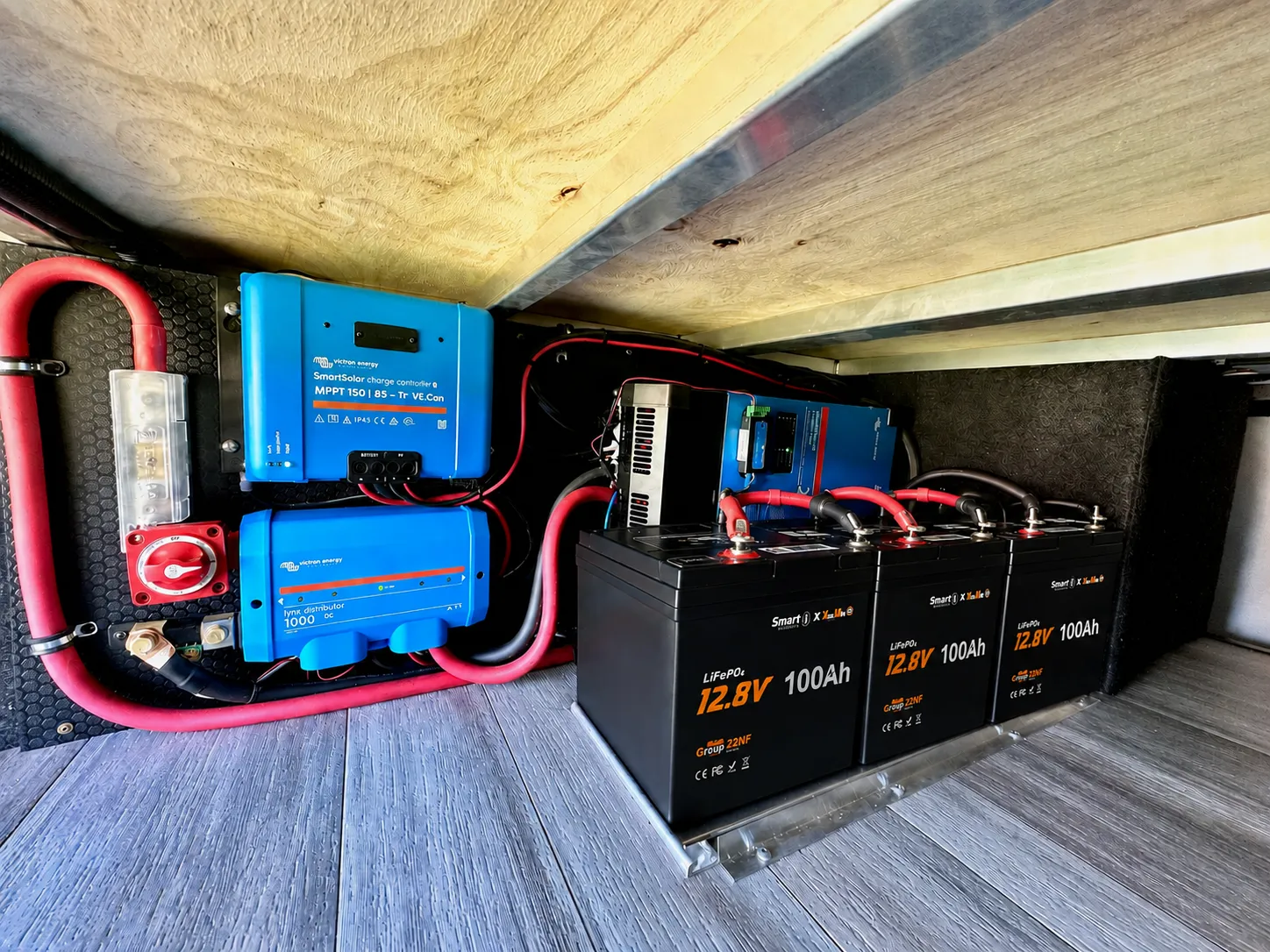 Three 12V 100Ah LiFePO4 batteries connected as a 12V 300Ah motorhome battery bank